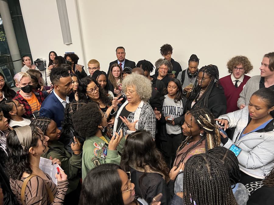 Angela Davis surrounded by a crowd during LMU's 