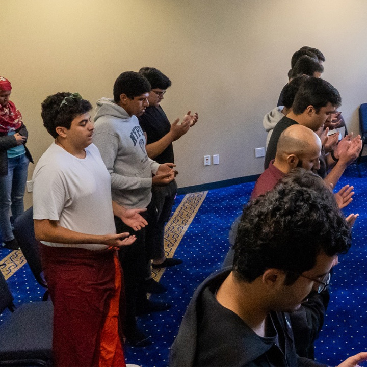 Students gather inside for a weekly Jummah Prayer Service.